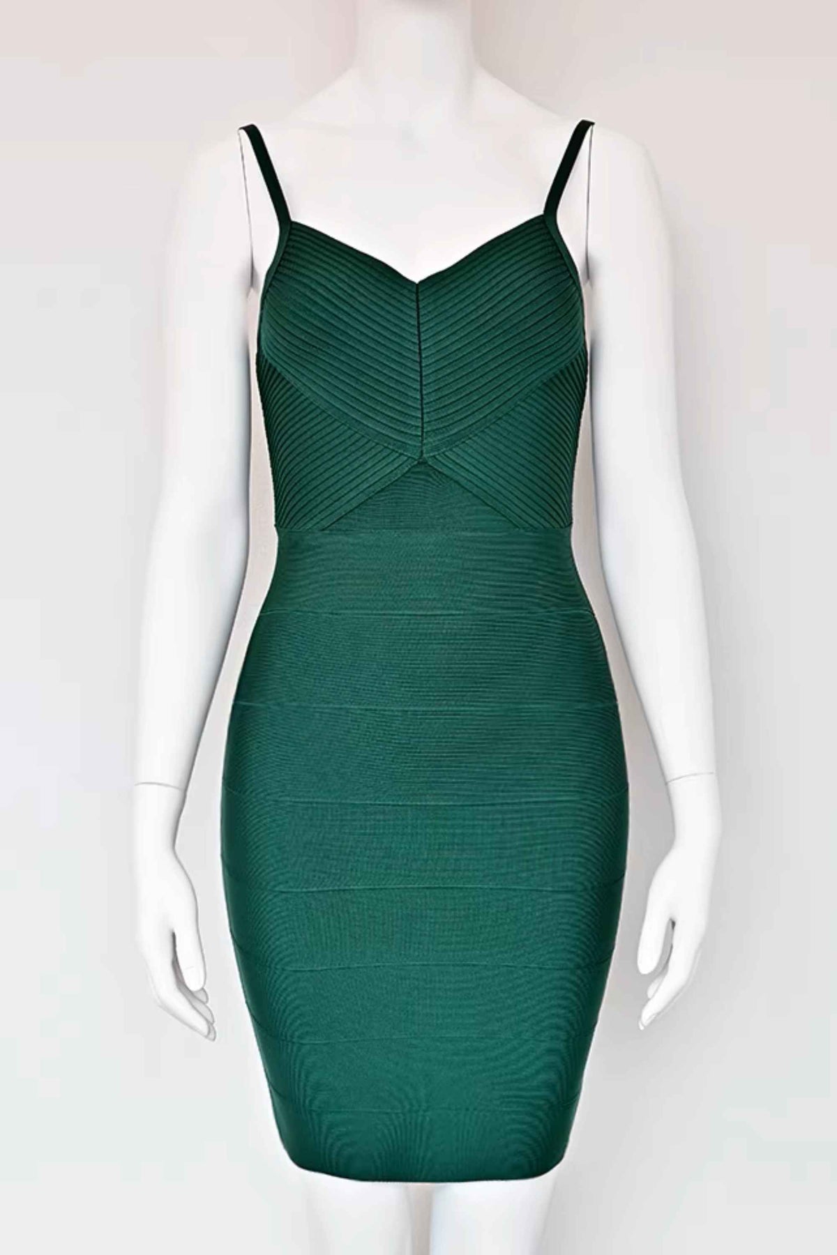 Woman wearing a figure flattering Jene Bandage Dress - Emerald Green BODYCON COLLECTION