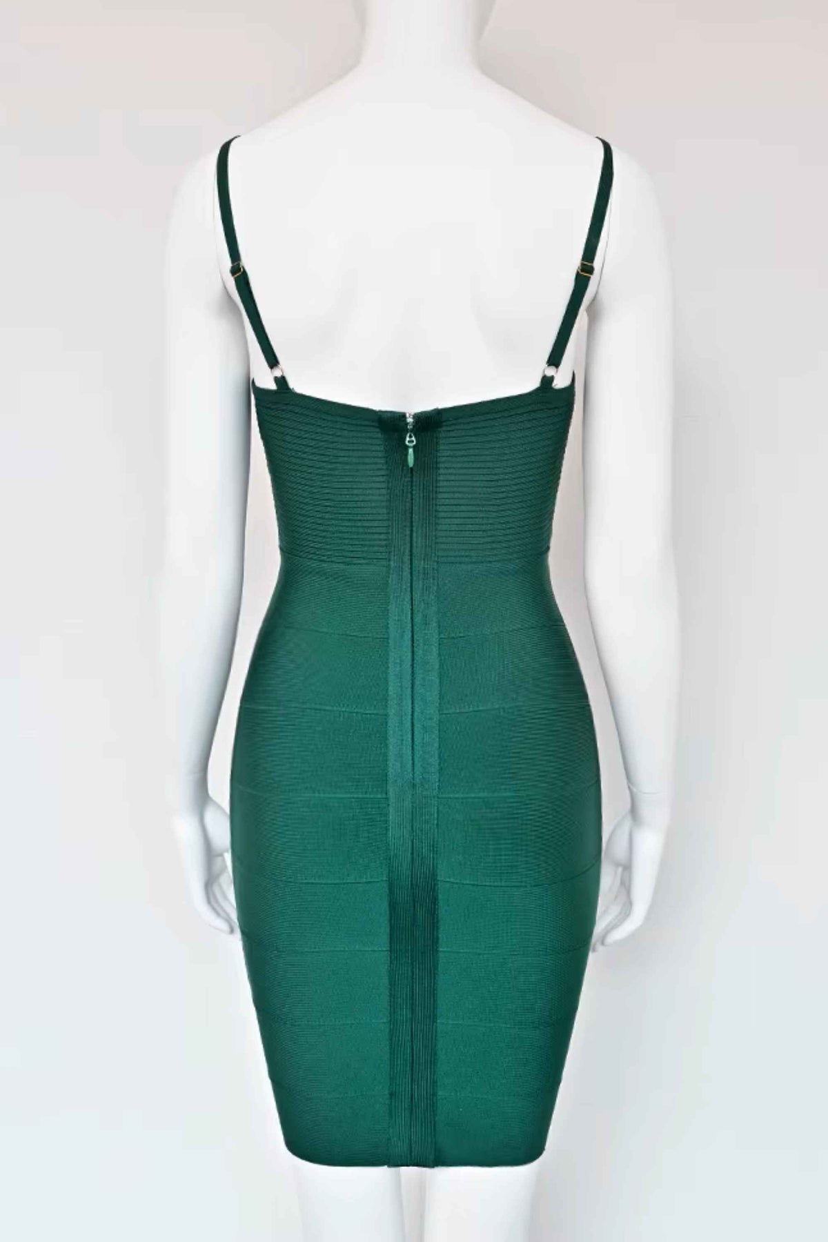 Woman wearing a figure flattering Jene Bandage Dress - Emerald Green BODYCON COLLECTION