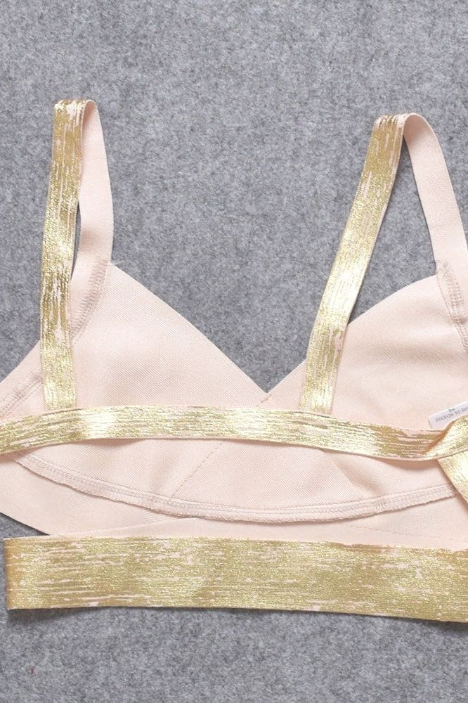 Woman wearing a figure flattering Jess Bandage Top and Mini Skirt Set - Gold BODYCON COLLECTION