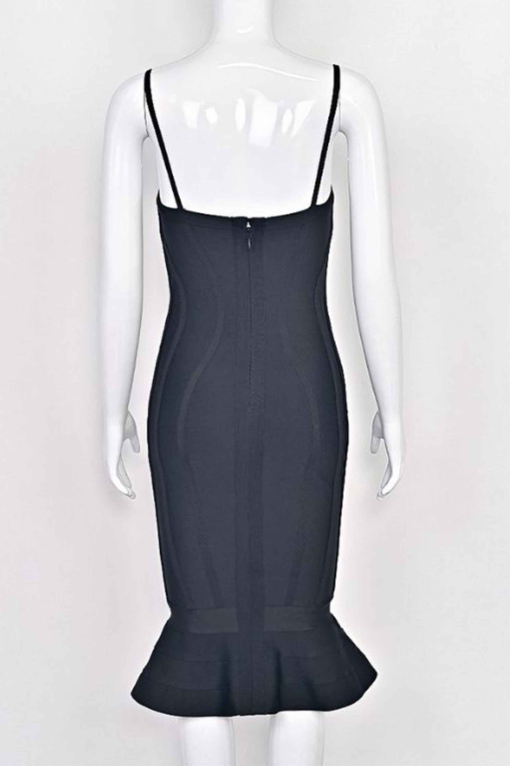 Woman wearing a figure flattering Joy Bandage Midi Dress - Classic Black Bodycon Collection