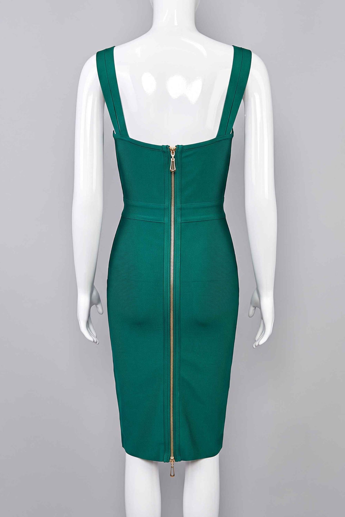 Woman wearing a figure flattering Kate Bandage Dress - Emerald Green Bodycon Collection