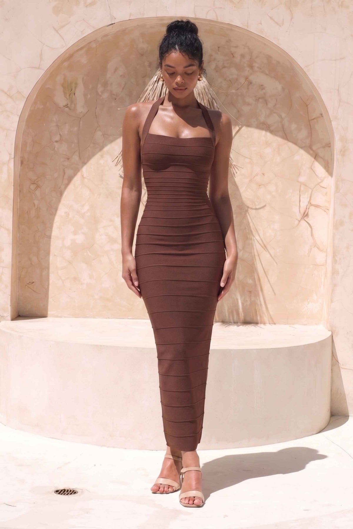 Woman wearing a figure flattering Kia Bandage Maxi Dress - Chocolate Brown BODYCON COLLECTION Pty Ltd