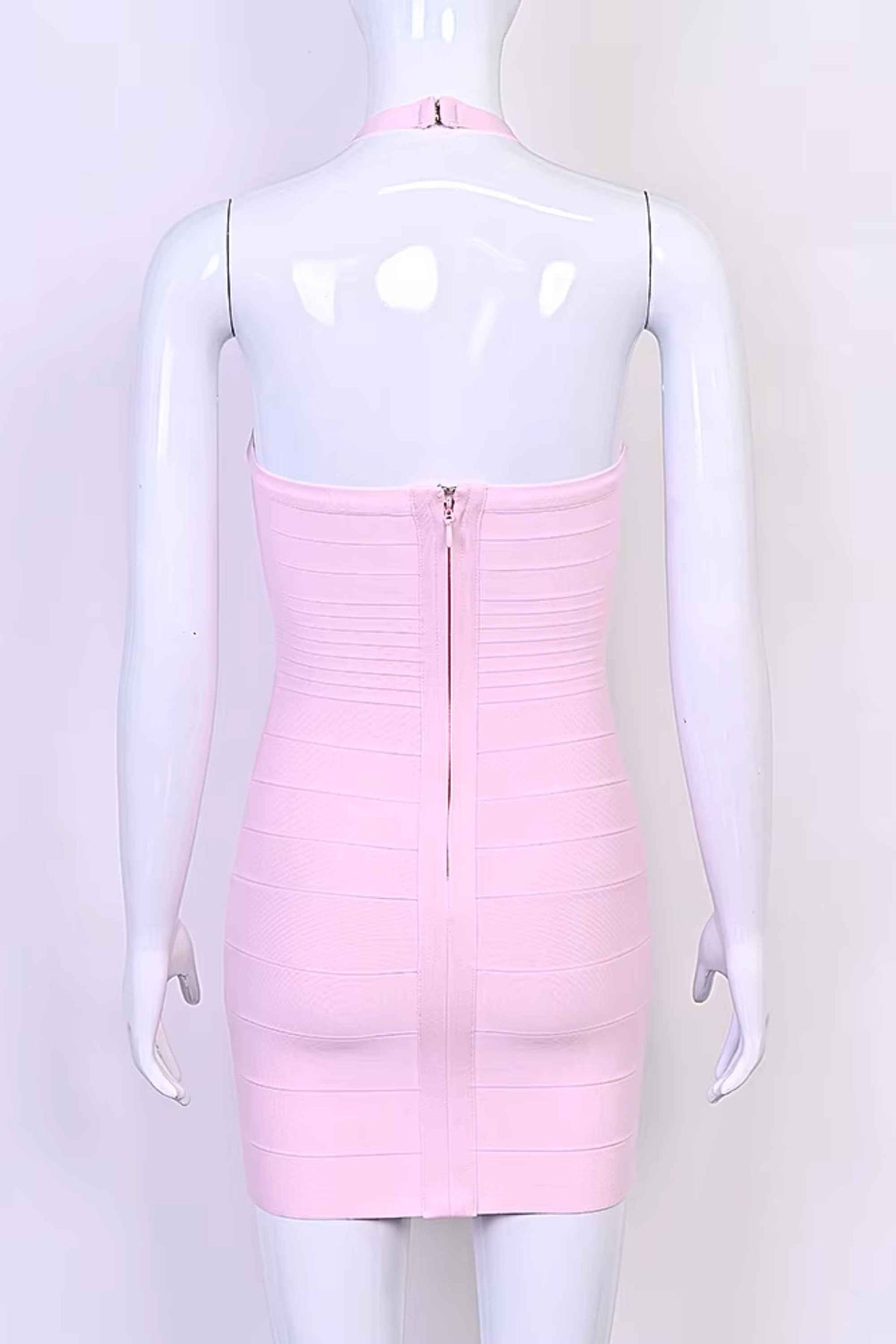 Woman wearing a figure flattering Kia Bandage Mini Dress - Dusty Pink BODYCON COLLECTION Pty Ltd
