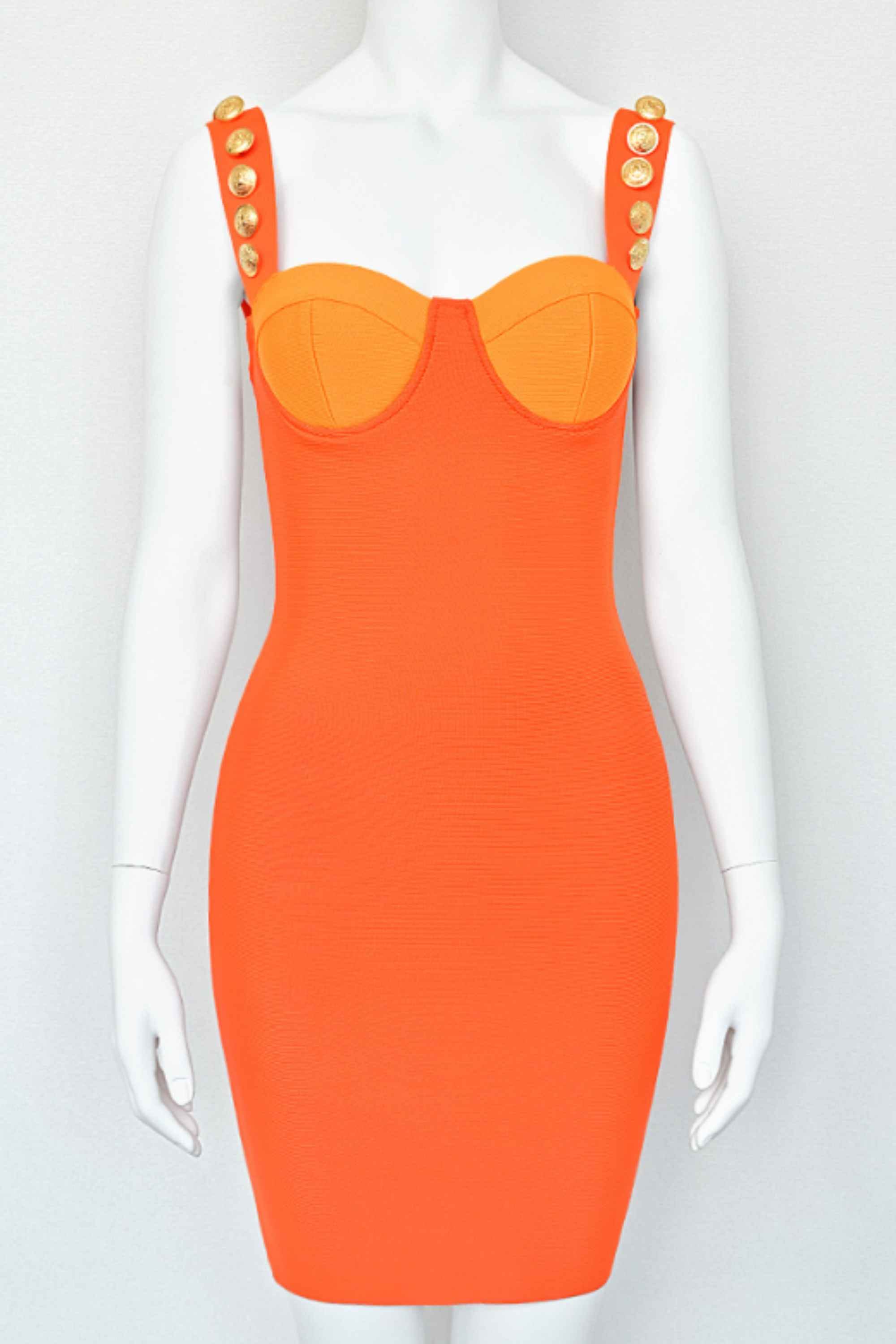Woman wearing a figure flattering Kiki Bandage Mini Dress - Apricot Orange BODYCON COLLECTION