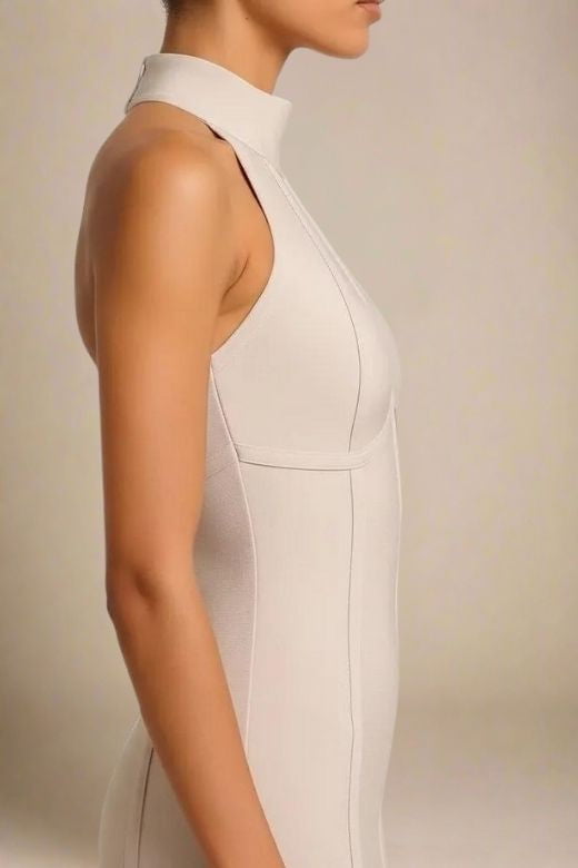 Woman wearing a figure flattering Lea Bandage Midi Dress - Beige Bodycon Collection
