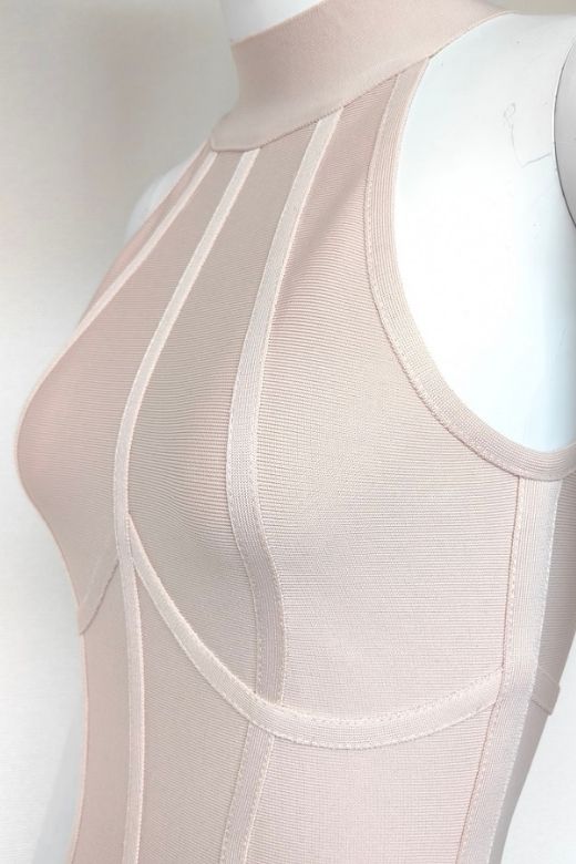 Woman wearing a figure flattering Lea Bandage Midi Dress - Beige Bodycon Collection