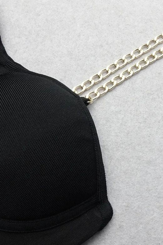 Woman wearing a figure flattering Leah Bodycon Dress - Classic Black Bodycon Collection