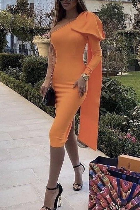 Woman wearing a figure flattering Lela Long Sleeve Bandage Midi Dress - Apricot Orange BODYCON COLLECTION