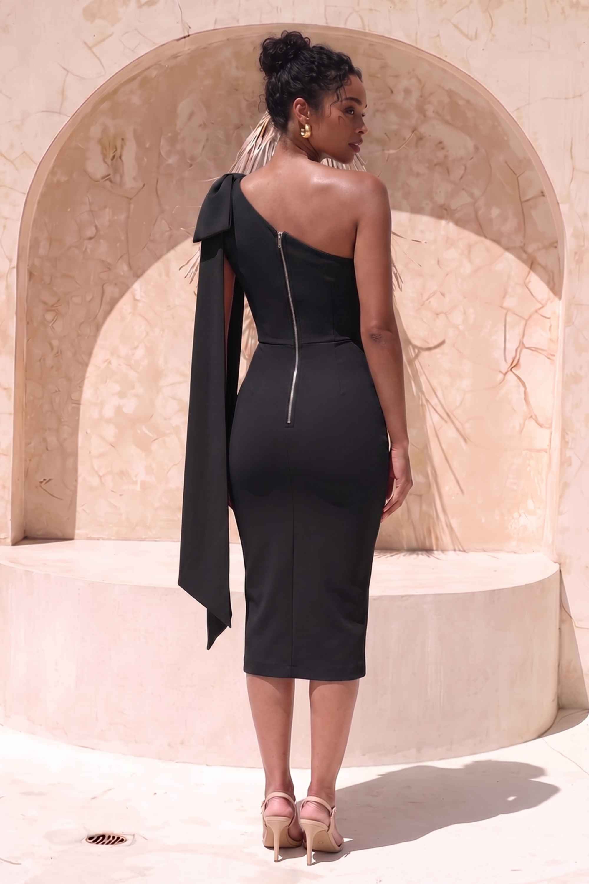 Woman wearing a figure flattering Lela Long Sleeve Bandage Midi Dress - Classic Black BODYCON COLLECTION