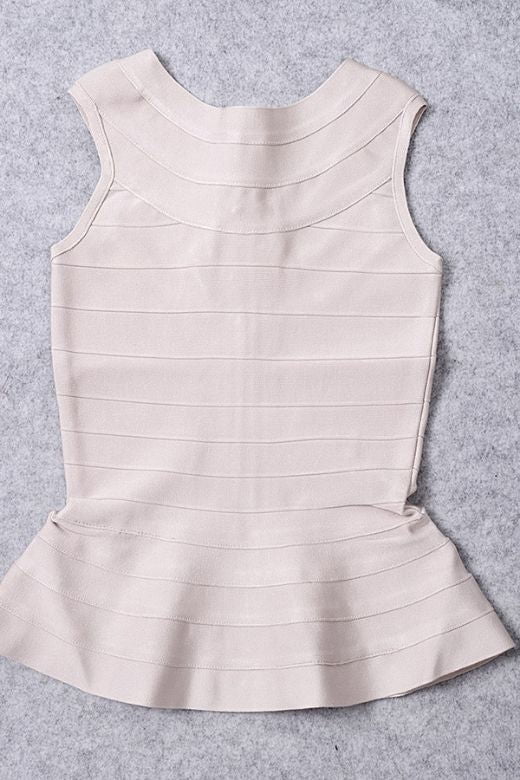 Woman wearing a figure flattering Leni Bandage Peplum Top - Beige BODYCON COLLECTION