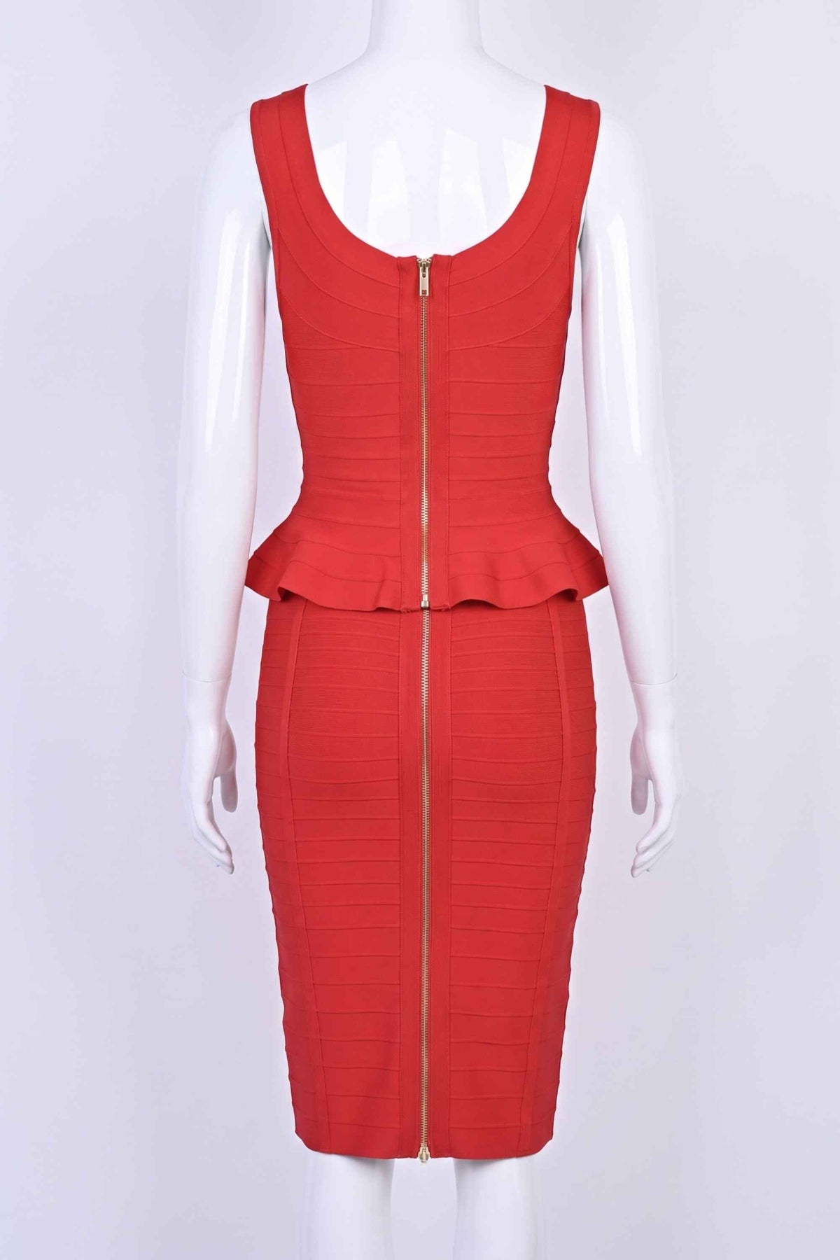 Woman wearing a figure flattering Leni Bandage Peplum Top - Lipstick Red BODYCON COLLECTION