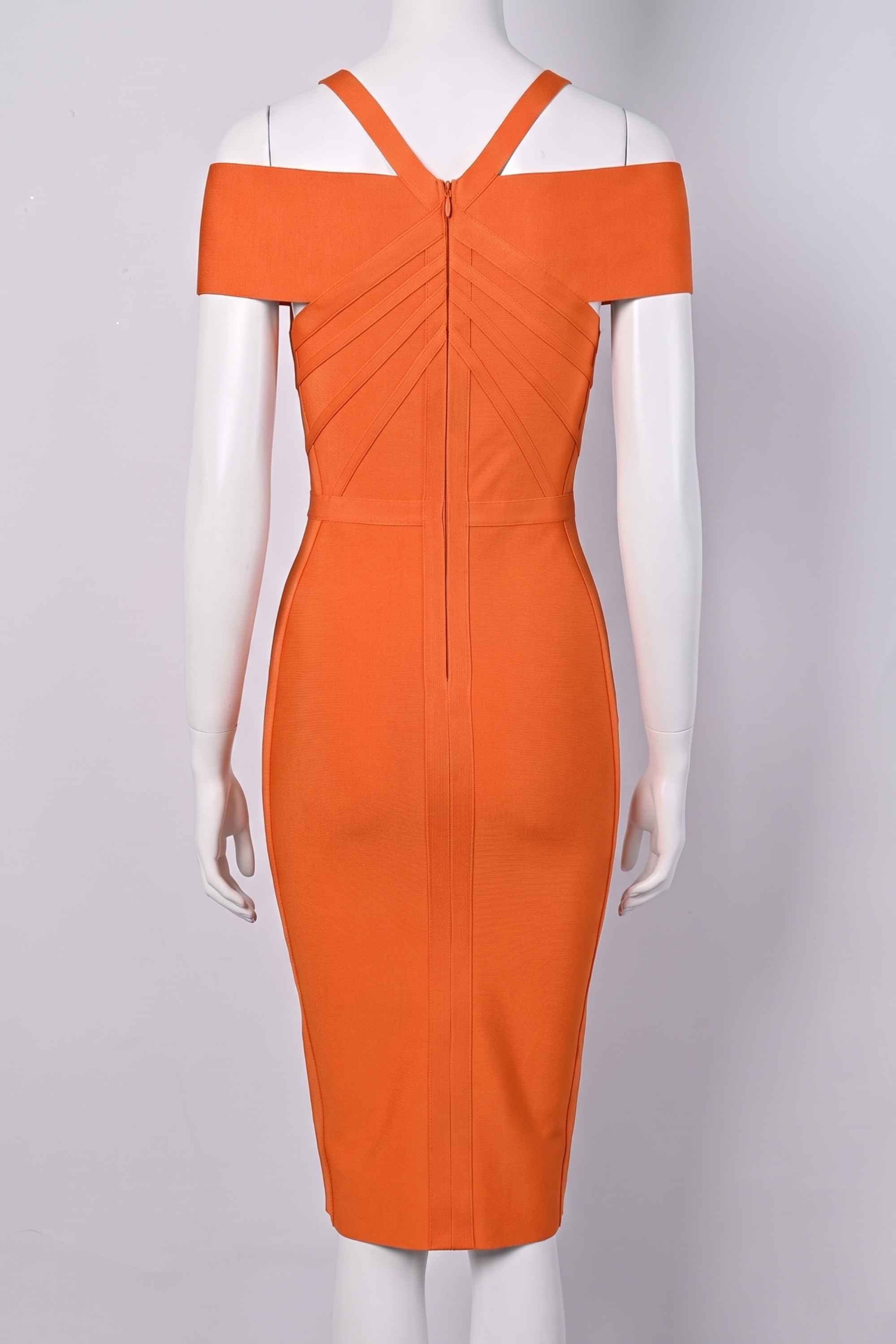 Woman wearing a figure flattering Leo Bandage Midi Dress - Apricot Orange Bodycon Collection