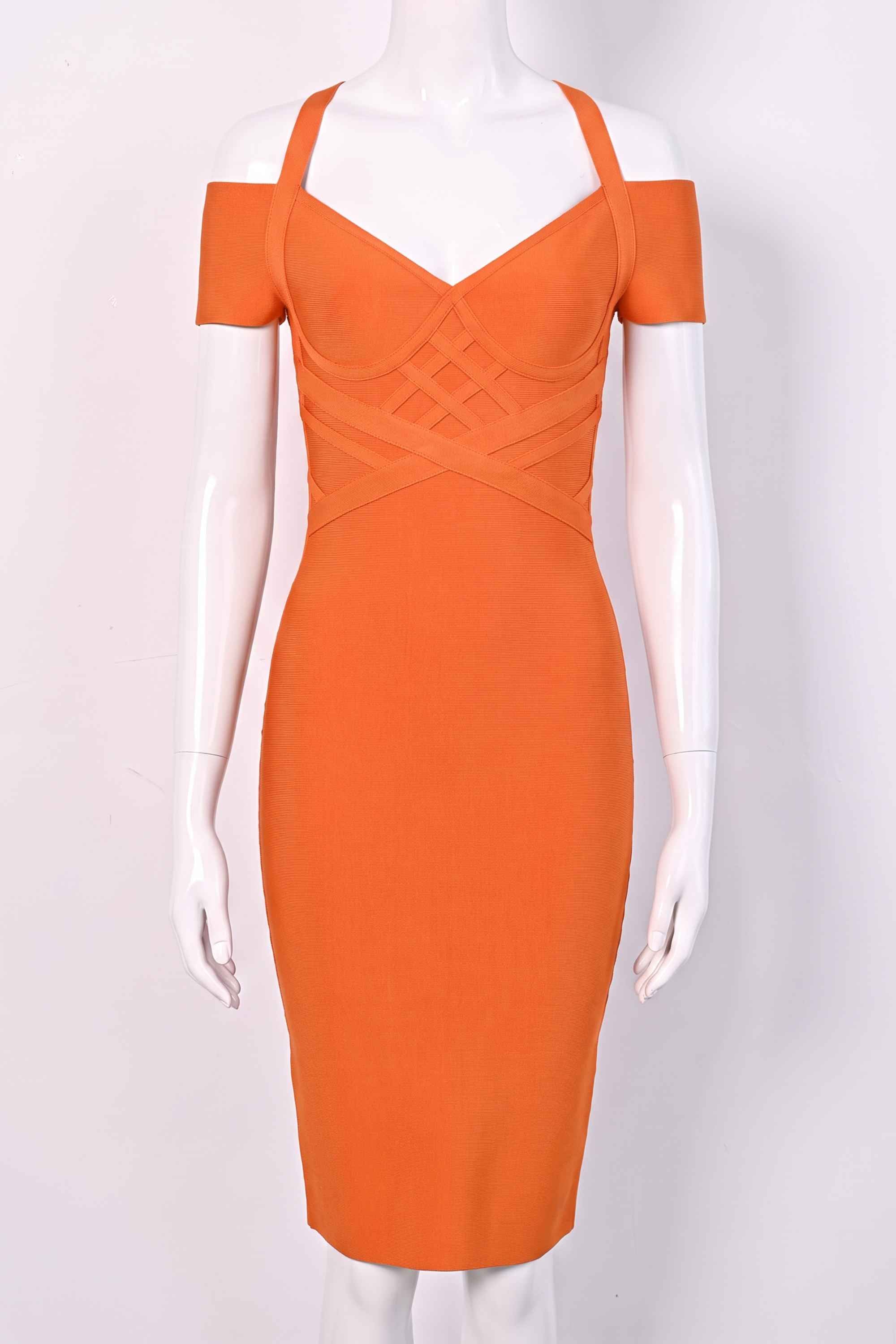 Woman wearing a figure flattering Leo Bandage Midi Dress - Apricot Orange Bodycon Collection