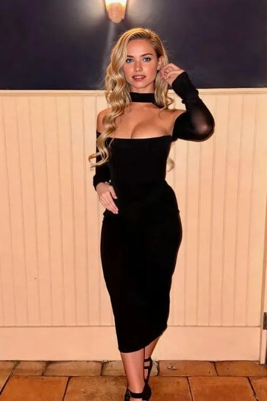 Woman wearing a figure flattering Lillian Bodycon Midi Dress - Classic Black BODYCON COLLECTION