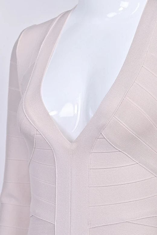 Woman wearing a figure flattering Lisa Long Sleeve Bandage Mini Dress - Cream BODYCON COLLECTION Pty Ltd