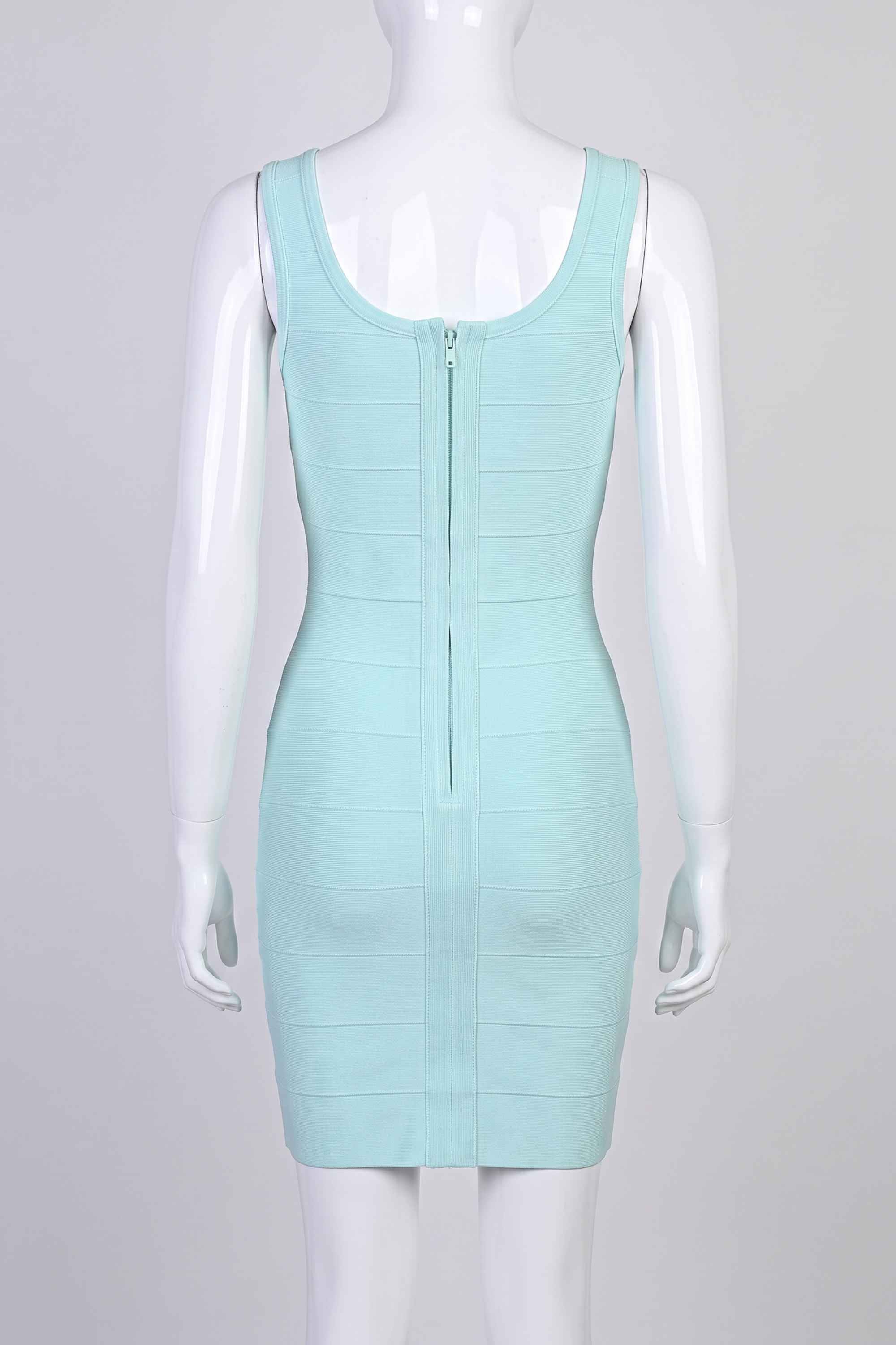 Woman wearing a figure flattering Maria Bandage Mini Dress - Baby Blue BODYCON COLLECTION
