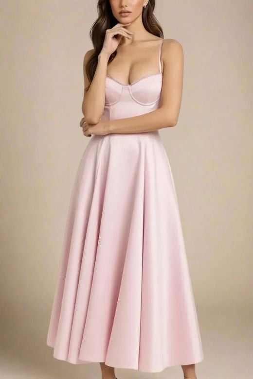 Woman wearing a figure flattering Mavis Midi Dress - Dusty Pink BODYCON COLLECTION