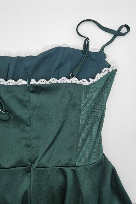 Woman wearing a figure flattering Mavis Midi Dress - Emerald Green BODYCON COLLECTION