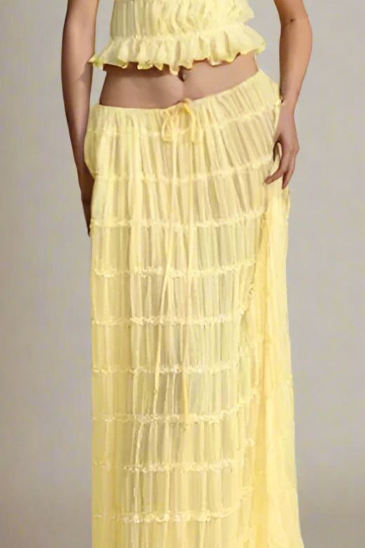 Woman wearing a figure flattering Meryl Wrap Top and Maxi Skirt Set - Butter Yellow BODYCON COLLECTION