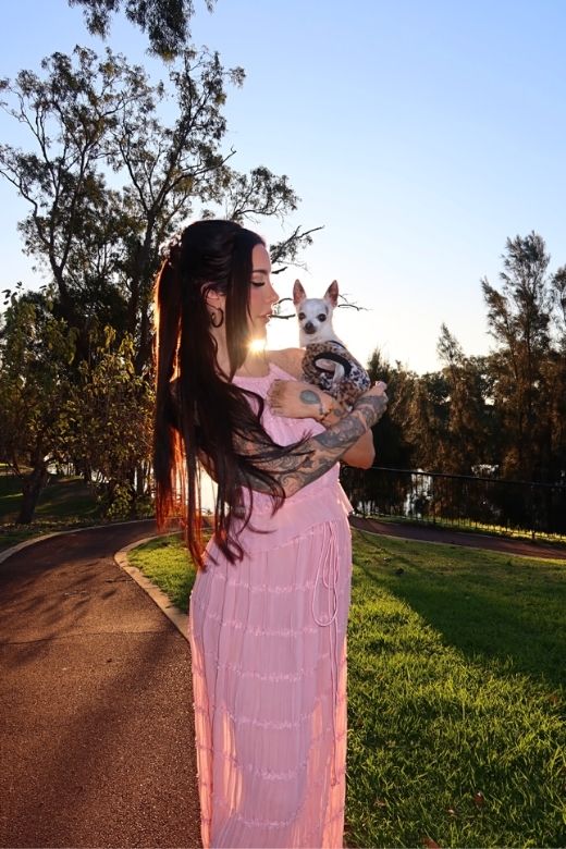 Woman wearing a figure flattering Meryl Wrap Top and Maxi Skirt Set - Pink Fuzz BODYCON COLLECTION