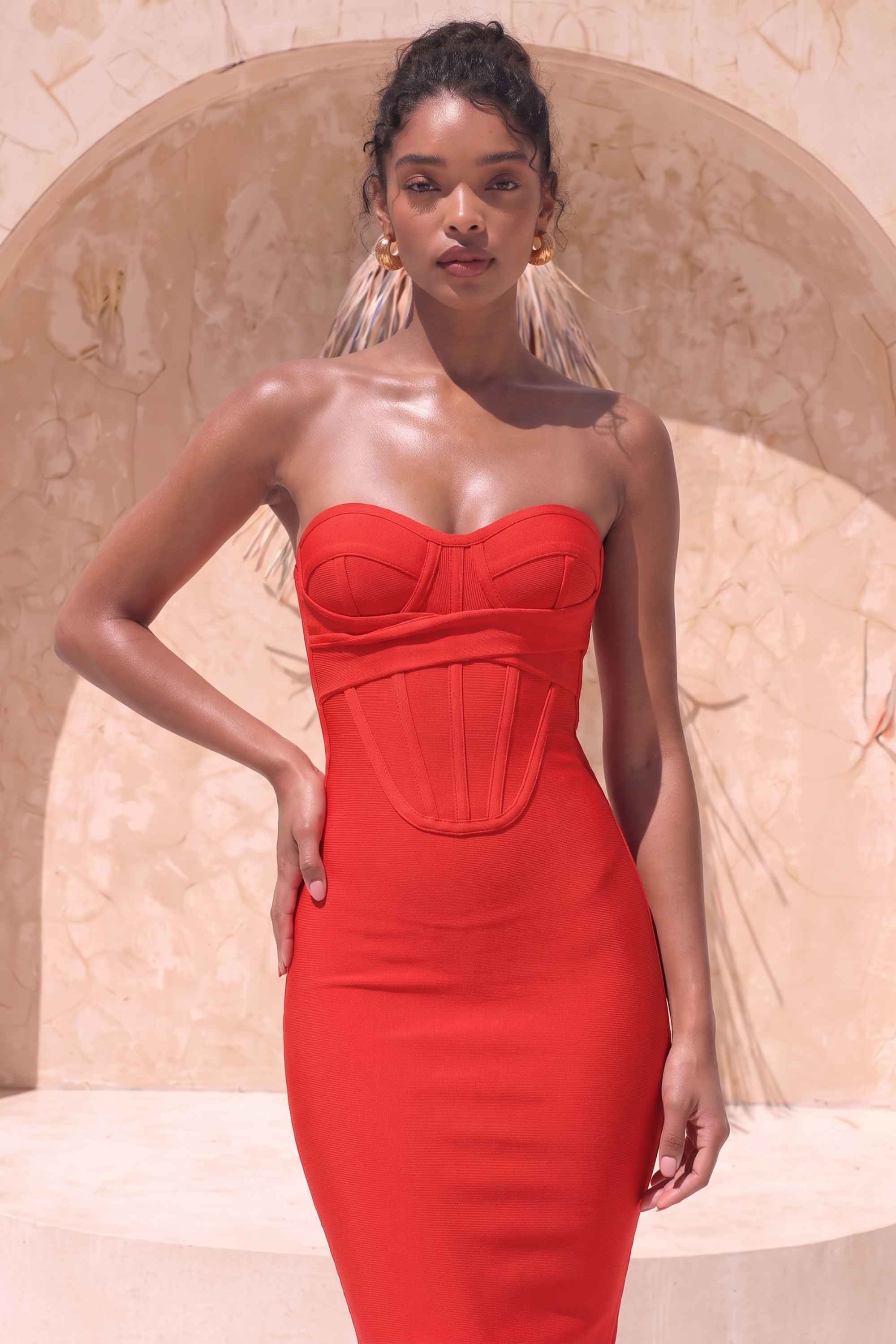 Woman wearing a figure flattering Miles Bodycon Midi Dress - Lipstick Red BODYCON COLLECTION
