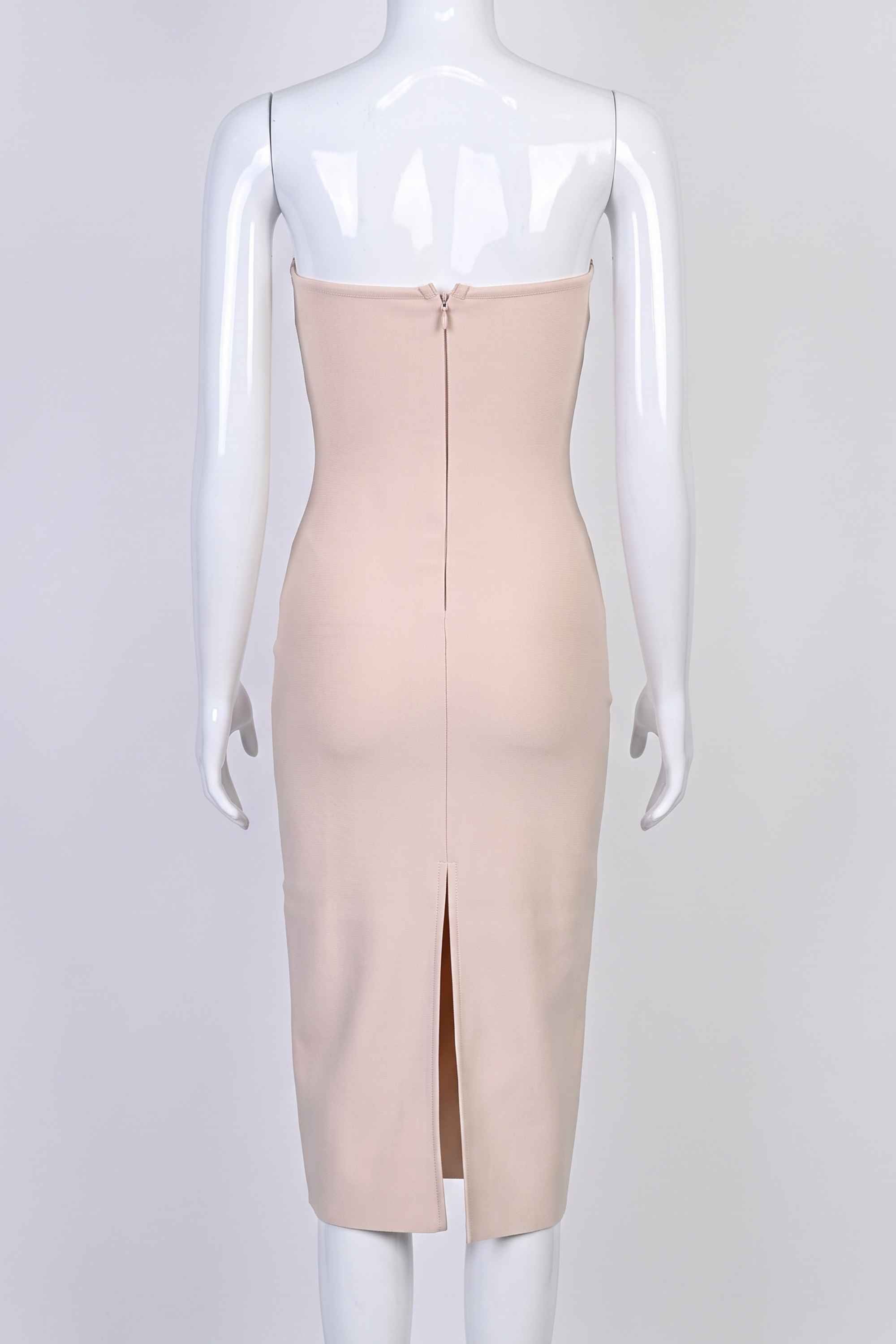 Woman wearing a figure flattering Miles Bodycon Midi Dress - Nude BODYCON COLLECTION