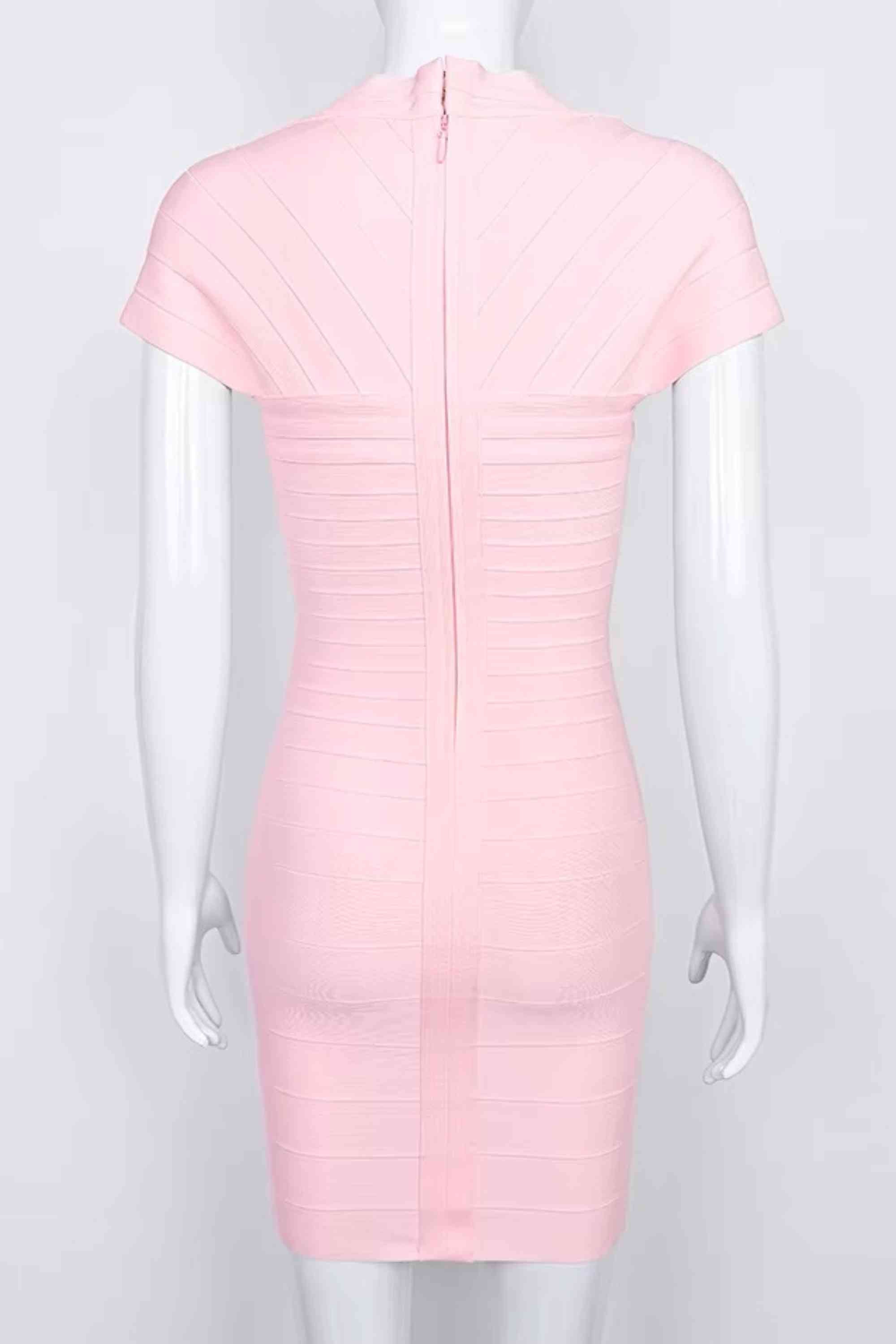 Woman wearing a figure flattering Miranda Bandage Mini Dress - Dusty Pink Bodycon Collection