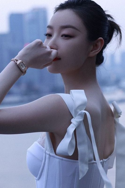 Woman wearing a figure flattering Payton Bandage Dress - Pearl White BODYCON COLLECTION