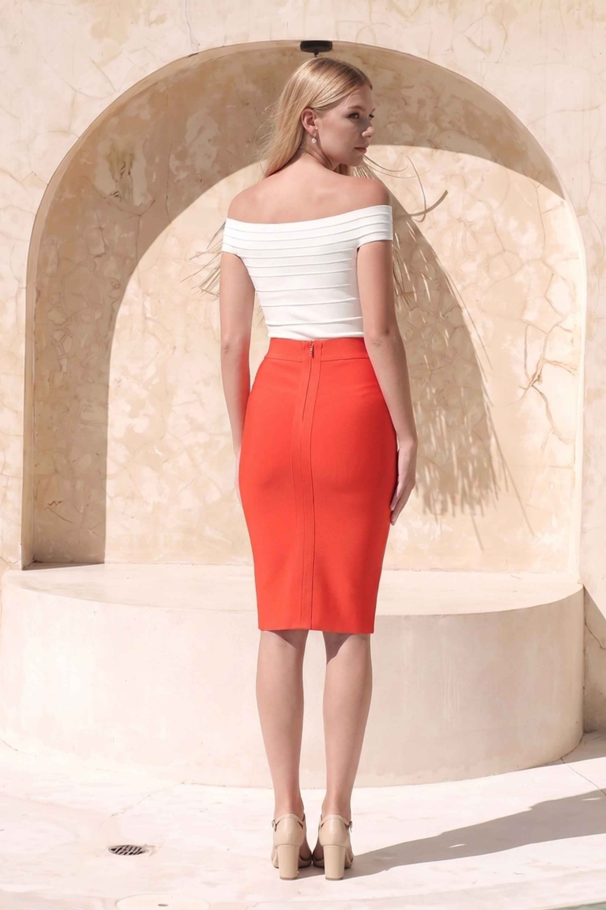 Woman wearing a figure flattering Pencil High Waist Bandage Knee Length Skirt - Lipstick Red BODYCON COLLECTION