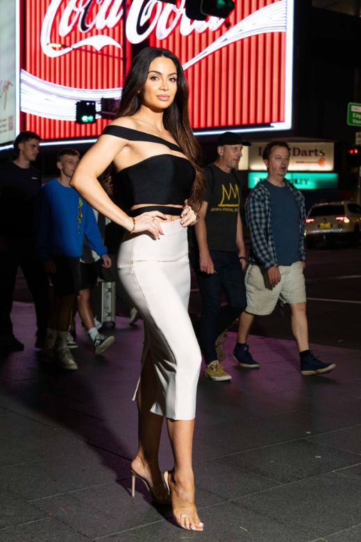 Woman wearing a figure flattering Pencil High Waist Bandage Midi Skirt - Classic Black BODYCON COLLECTION