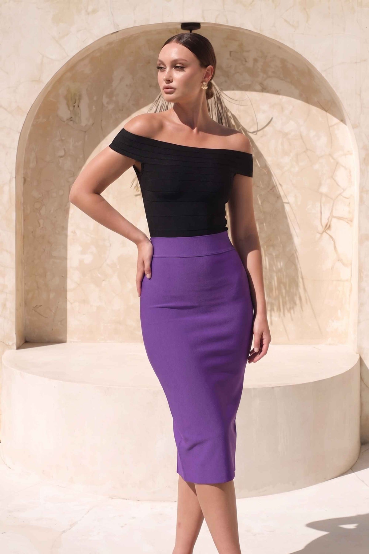 Woman wearing a figure flattering Pencil High Waist Bandage Midi Skirt - Plum Purple BODYCON COLLECTION