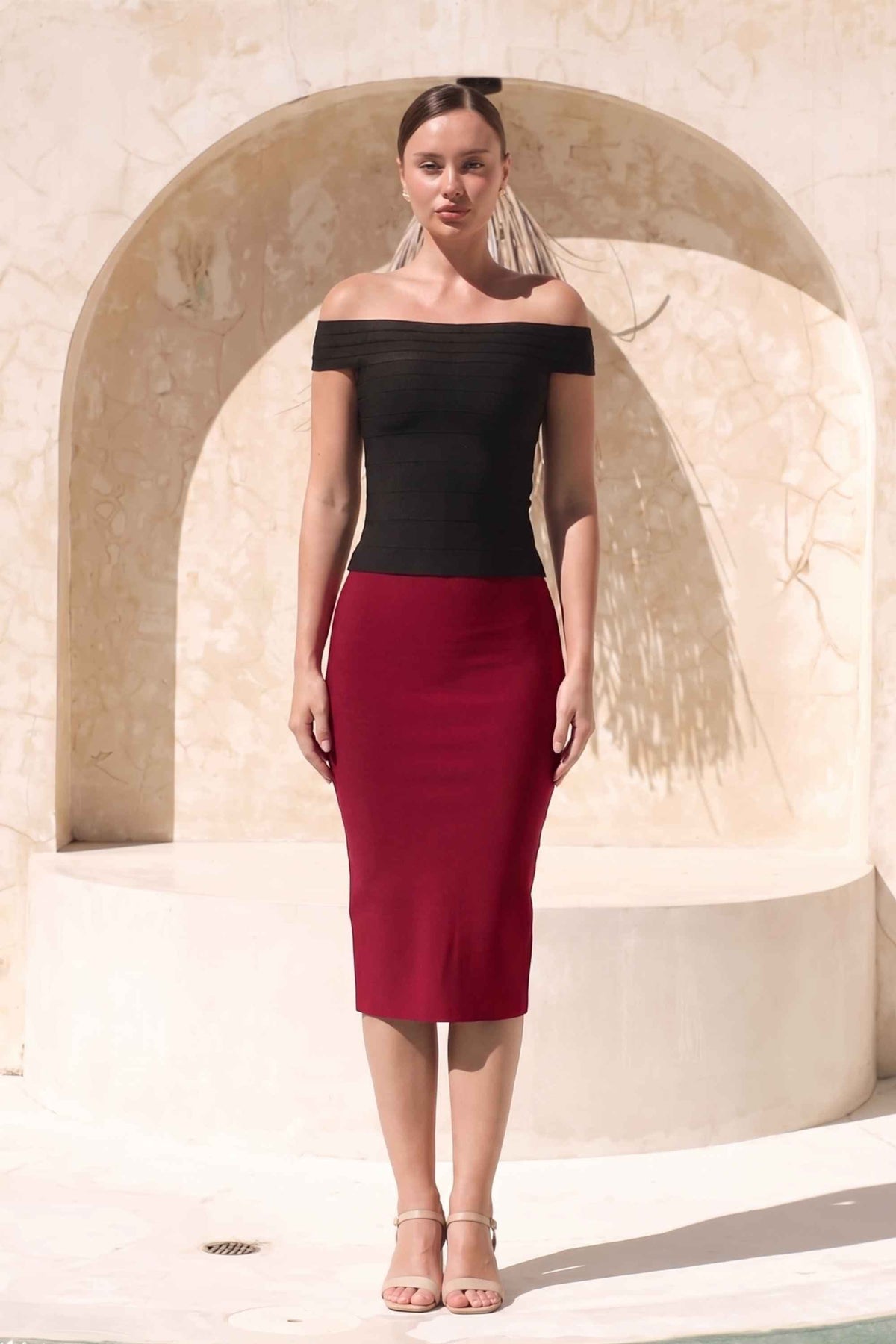 Woman wearing a figure flattering Pencil High Waist Bandage Midi Skirt - Red Wine BODYCON COLLECTION