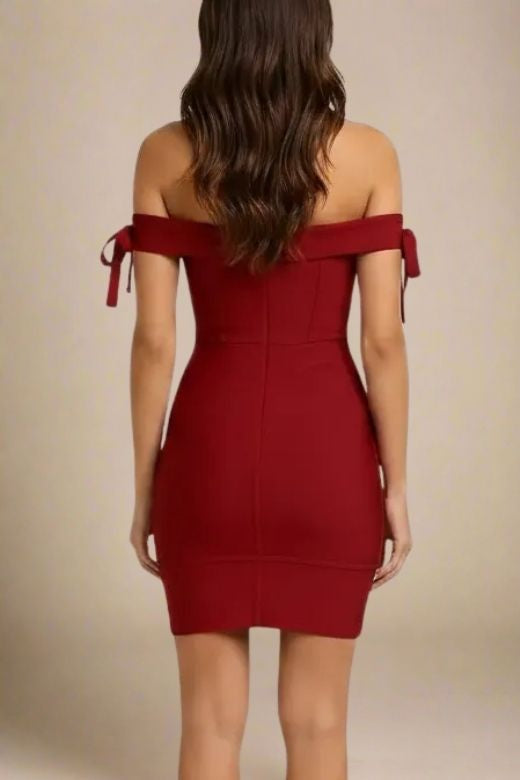 Woman wearing a figure flattering Penelope Bandage Mini Dress - Red Wine BODYCON COLLECTION