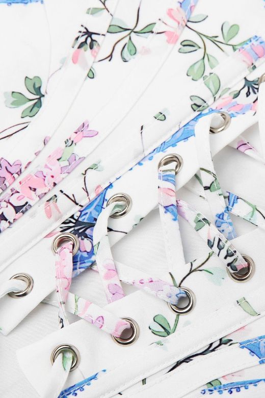 Woman wearing a figure flattering Penny Corset Top - White Floral BODYCON COLLECTION Pty Ltd