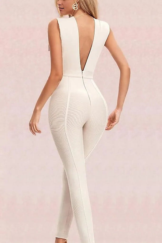 Woman wearing a figure flattering  Pia Bandage Pants Jumpsuit - Cream BODYCON COLLECTION