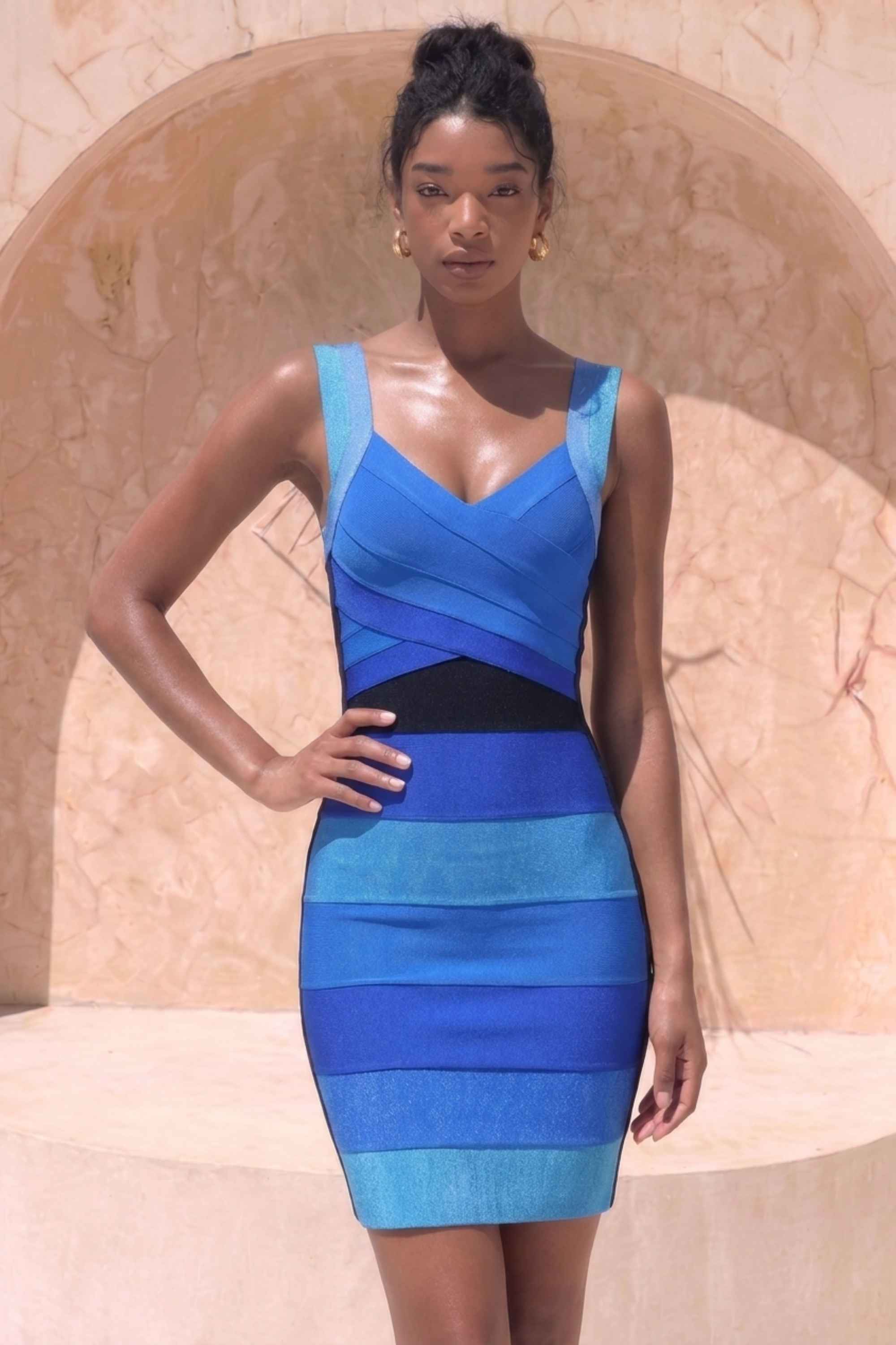 Woman wearing a figure flattering Portia Bandage Mini Dress - Royal Blue BODYCON COLLECTION Pty Ltd