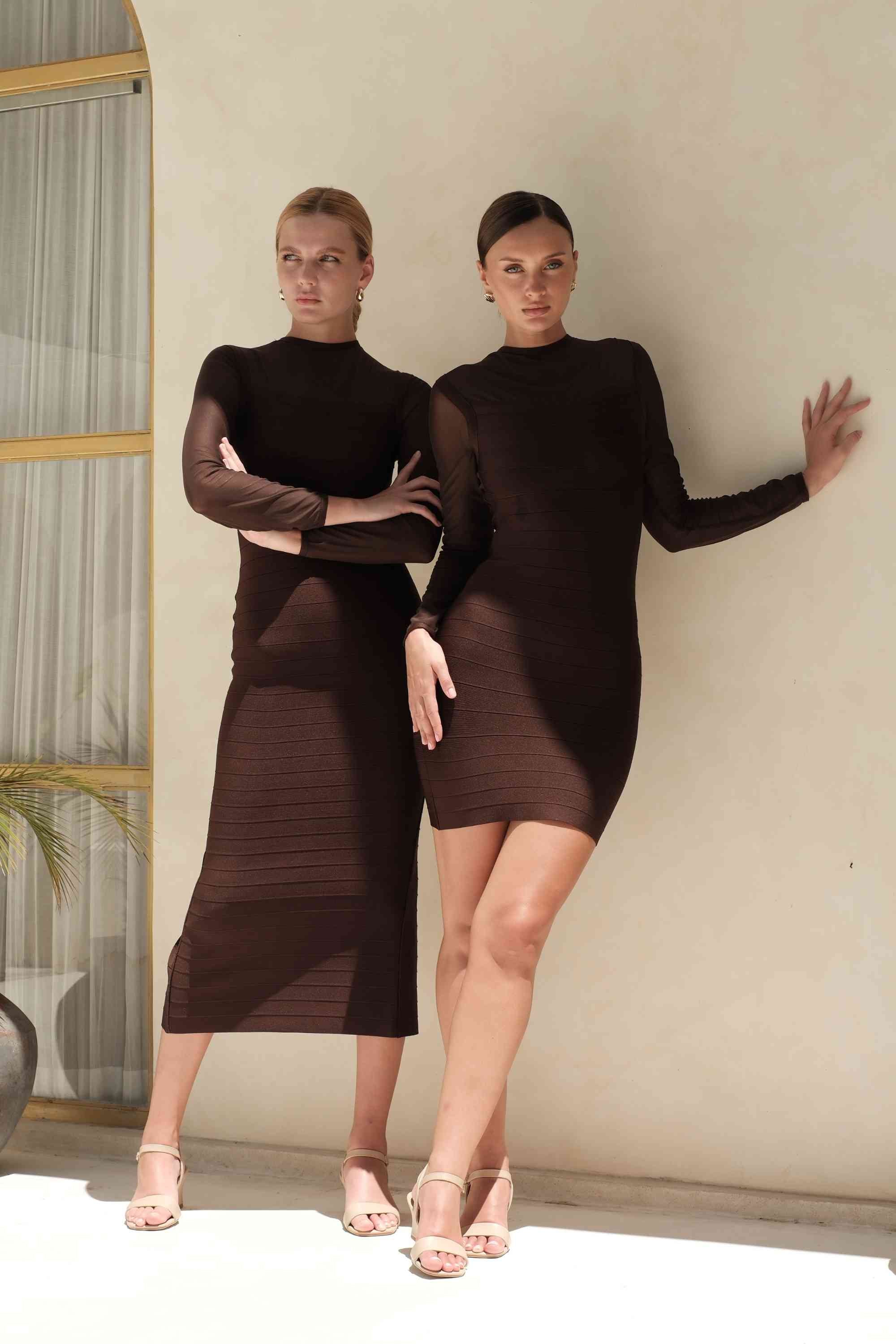 Woman wearing a figure flattering Robin Long Sleeve Bandage Maxi Dress - White Pearl BODYCON COLLECTION Pty Ltd