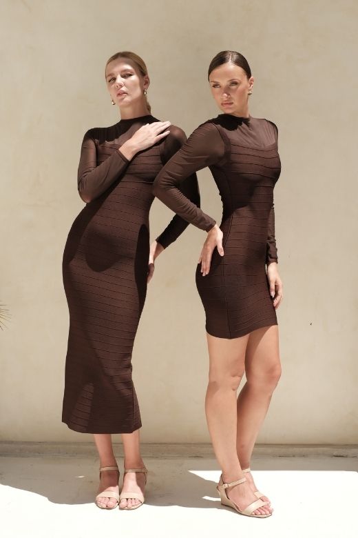 Woman wearing a figure flattering Robin Long Sleeve Bandage Mini Dress - White Pearl BODYCON COLLECTION Pty Ltd