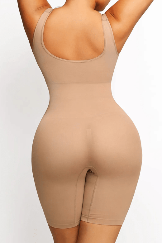 Woman wearing a figure flattering Round Neck One Piece Bodysuit Shapewear - Mid Thigh Bodycon Collection