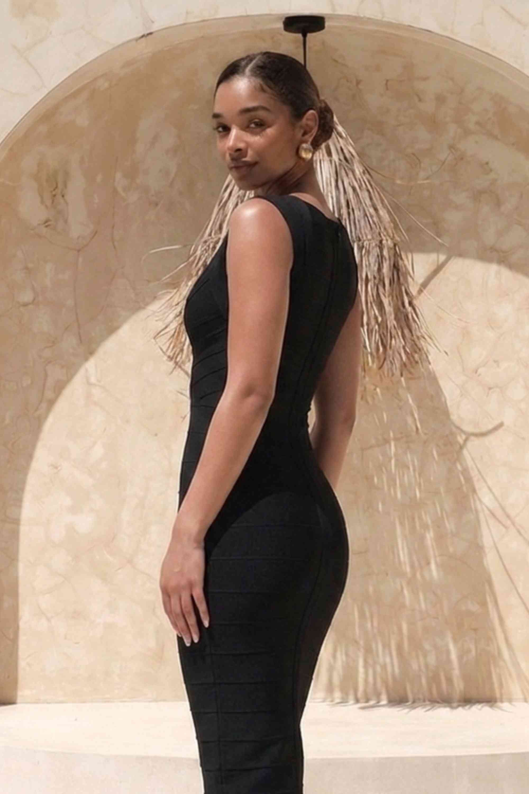 Woman wearing a figure flattering Sabrina Bandage Midi Dress - Classic Black BODYCON COLLECTION Pty Ltd