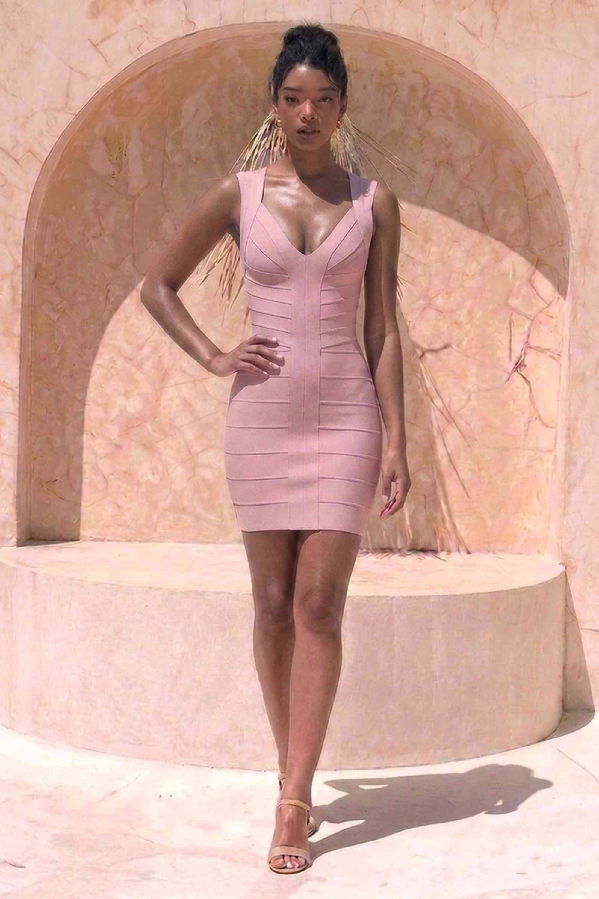 Woman wearing a figure flattering Sabrina Bandage Mini Dress - Pale Pink BODYCON COLLECTION Pty Ltd