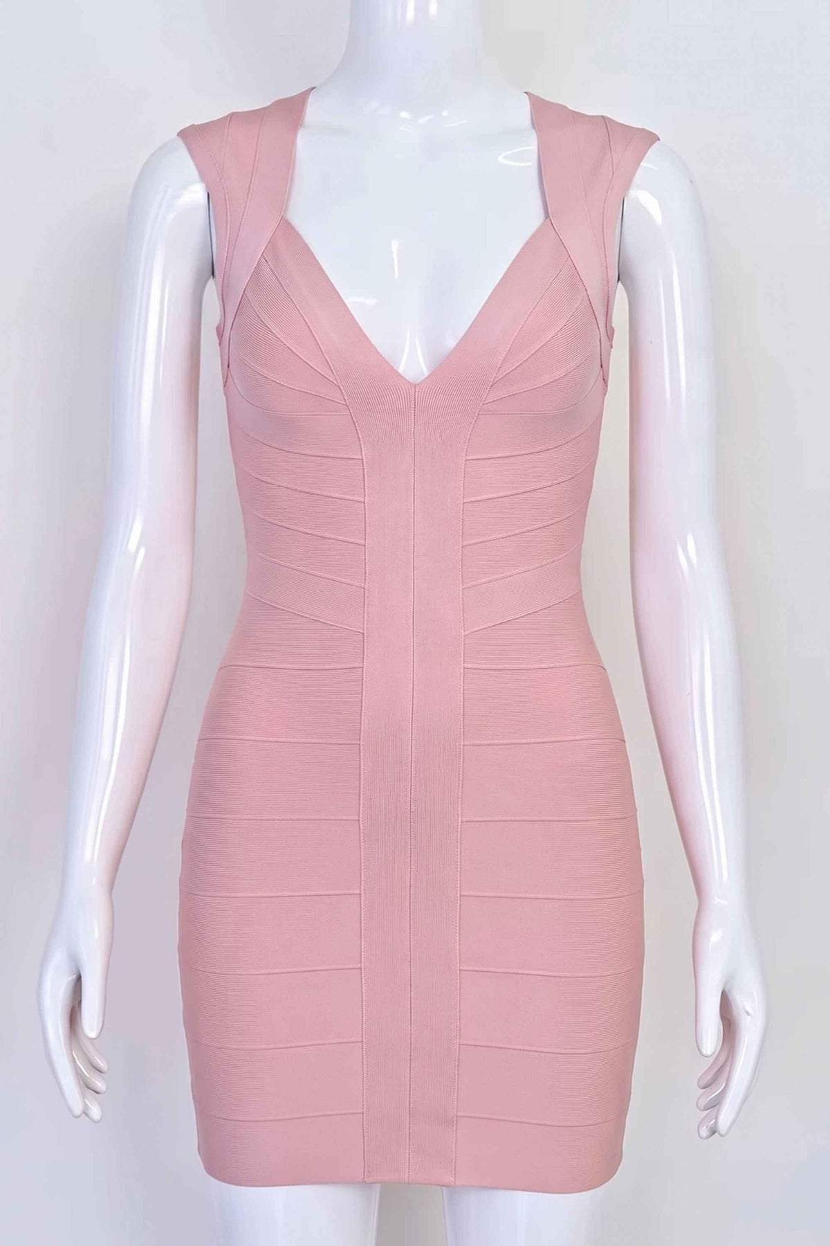 Woman wearing a figure flattering Sabrina Bandage Mini Dress - Pale Pink BODYCON COLLECTION Pty Ltd