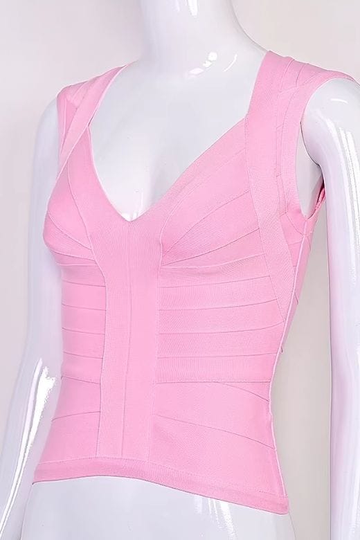 Woman wearing a figure flattering Sabrina Bandage Top - Dusty Pink BODYCON COLLECTION Pty Ltd