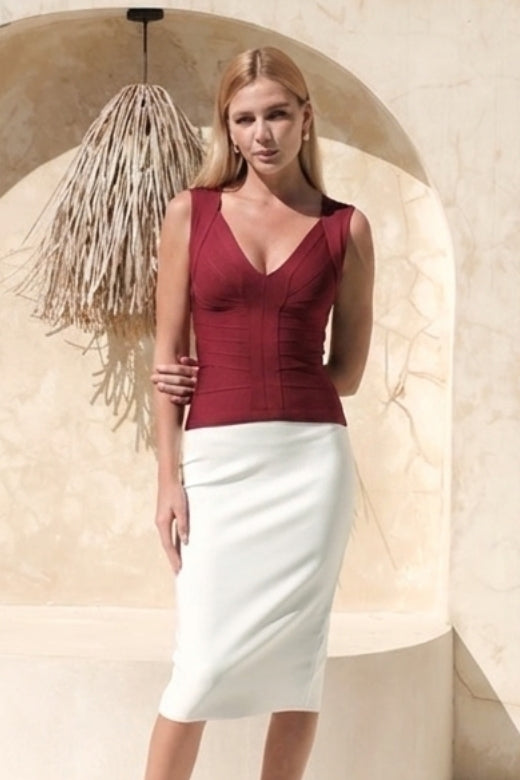 Woman wearing a figure flattering Sabrina Bandage Top - Red Wine BODYCON COLLECTION Pty Ltd