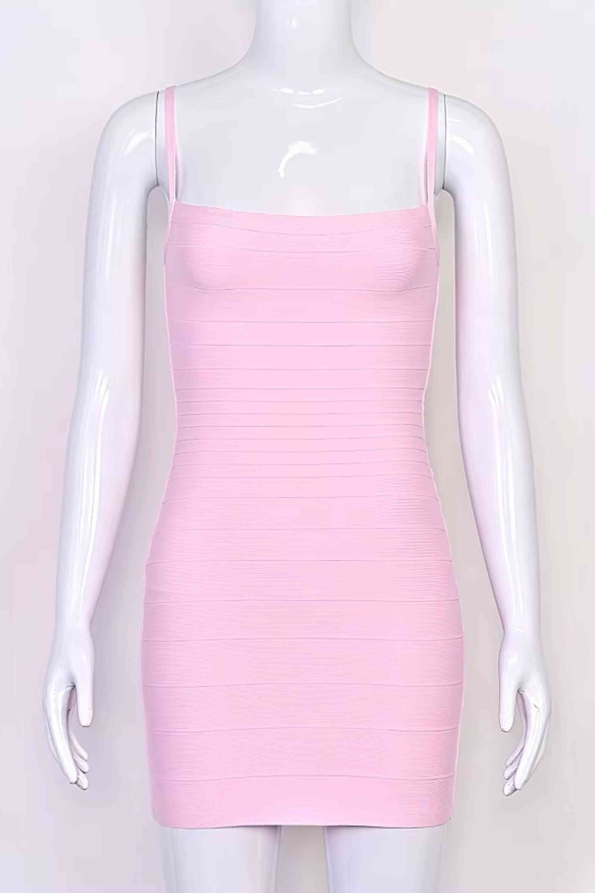 Woman wearing a figure flattering Scarlett Bandage Mini Dress - Dusty Pink BODYCON COLLECTION Pty Ltd