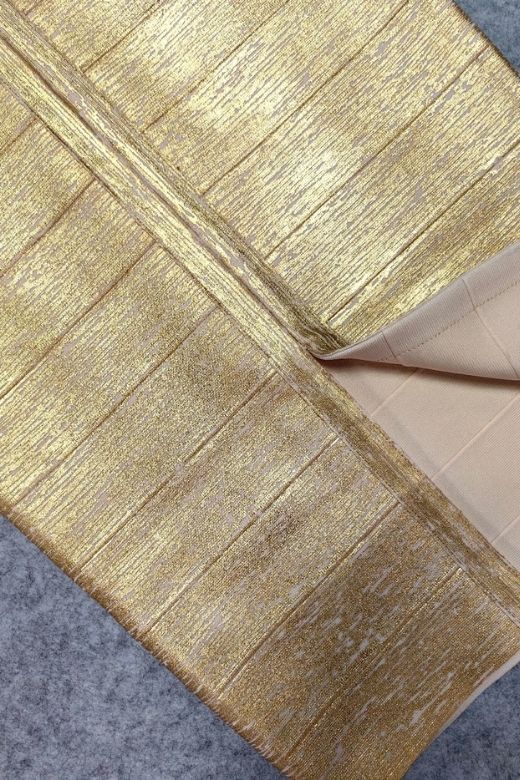 Woman wearing a figure flattering Selene Bandage Crop Top and Midi Skirt Set - Gold BODYCON COLLECTION Pty Ltd