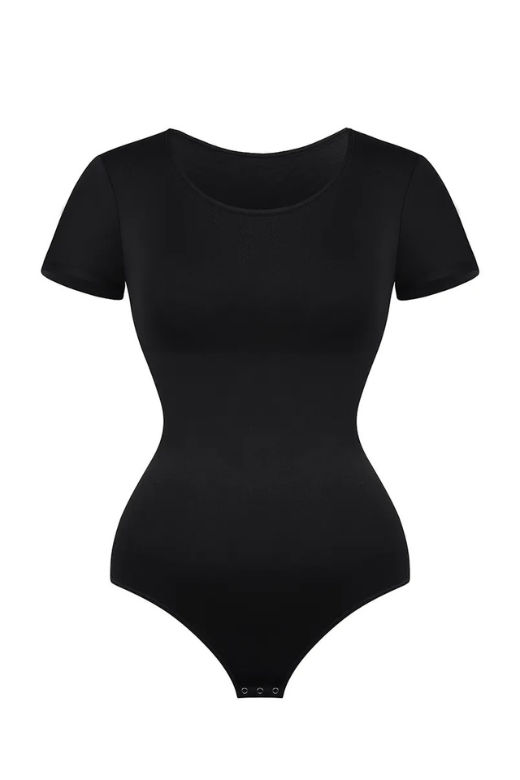 Woman wearing a figure flattering  Short Sleeve One Piece Bodysuit Shapewear - Thong BODYCON COLLECTION