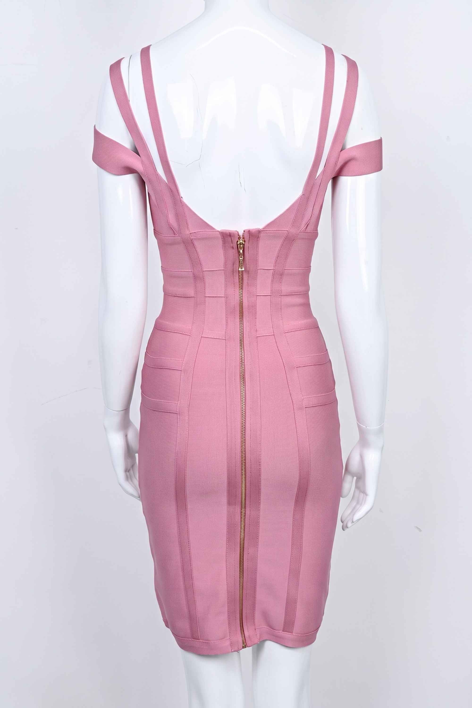 Woman wearing a figure flattering Sia Bandage Dress - Ballet Pink Bodycon Collection