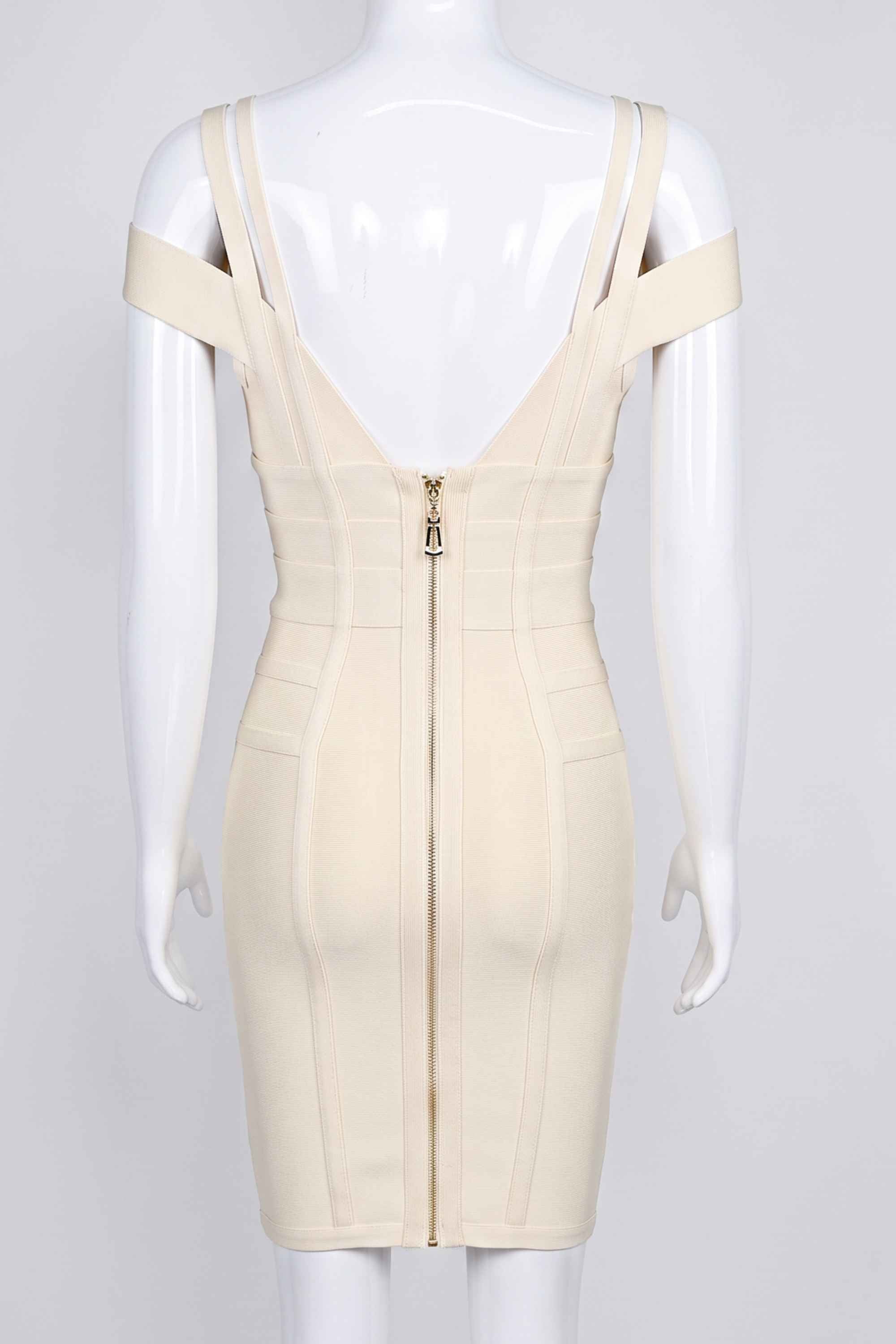 Woman wearing a figure flattering Sia Bandage Dress - Cream Bodycon Collection