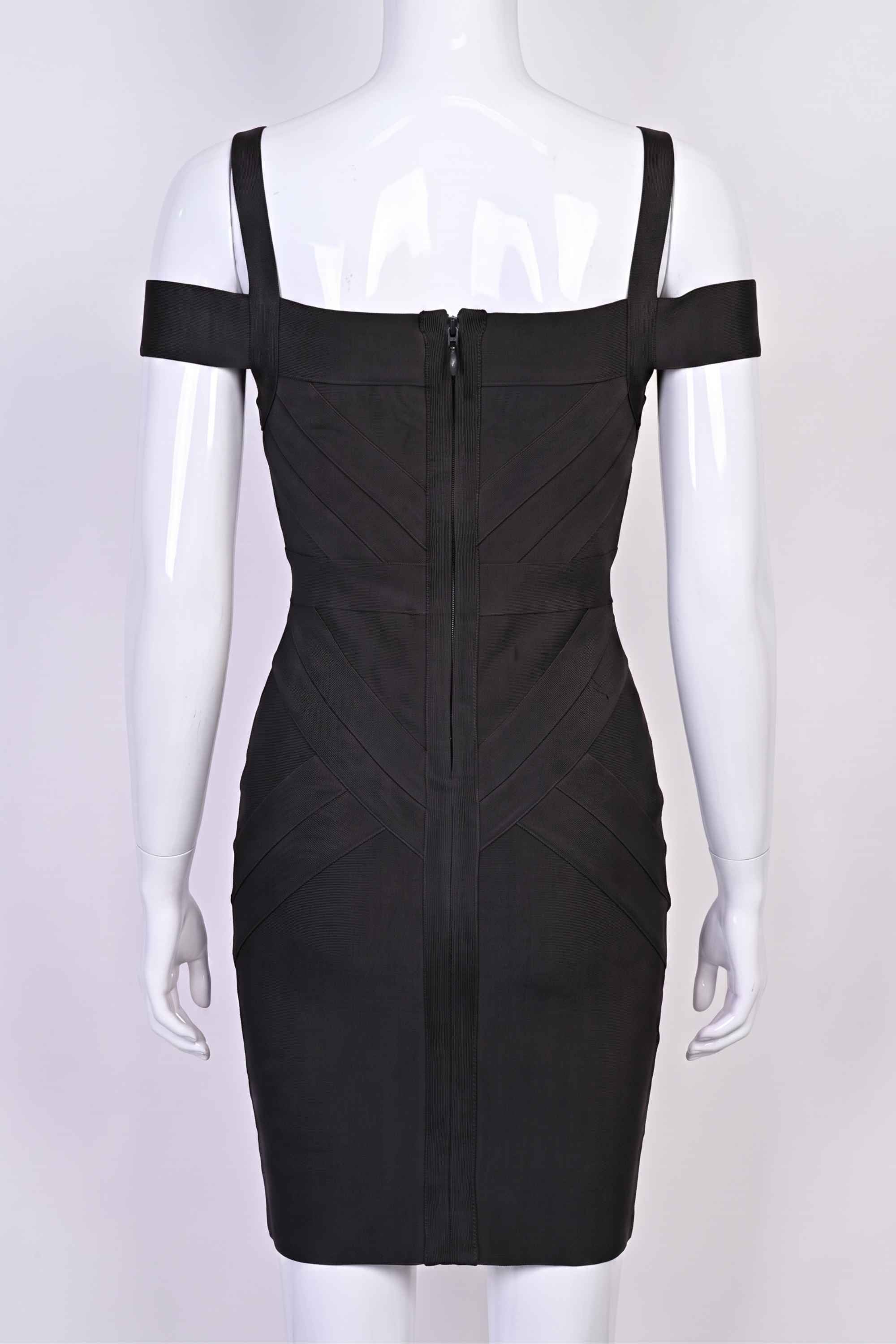 Woman wearing a figure flattering Sophia Bandage Dress - Classic Black Bodycon Collection